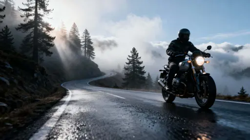 Motorcyclist Riding Foggy Mountain Road