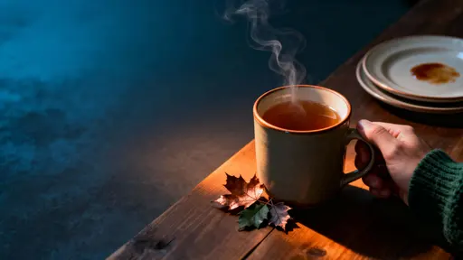 Mug and hand at night table