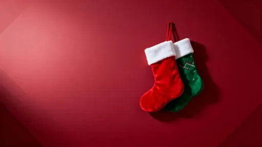 Stockings on crimson Christmas background