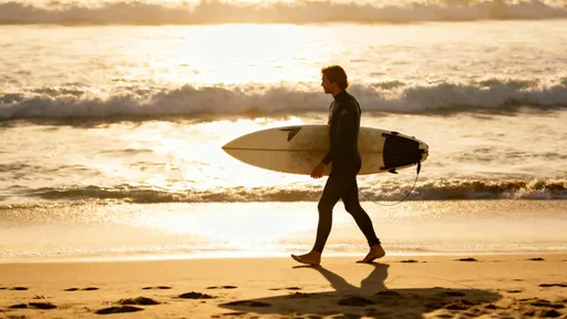 Surfer Walking Along Malibu Beach