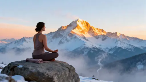 Woman meditating on mountain rock
