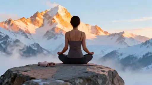 Woman meditating on mountain rock